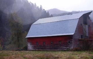 barn by a mountain