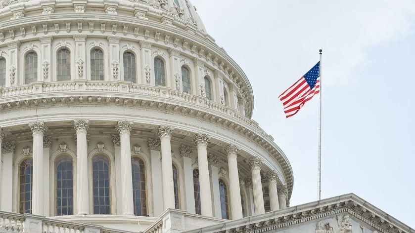 US Capitol with US flag in the foreground