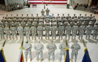 Soldiers stand at parade rest