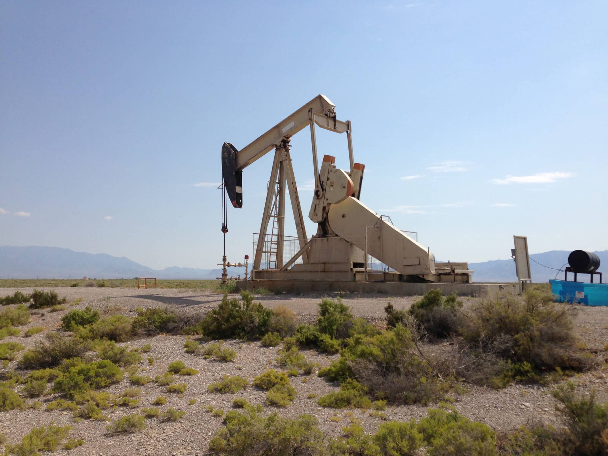 An oil pumpjack with a blue sky in the background