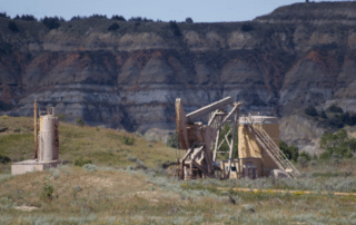 Oil Well in Badlands 900x472 1