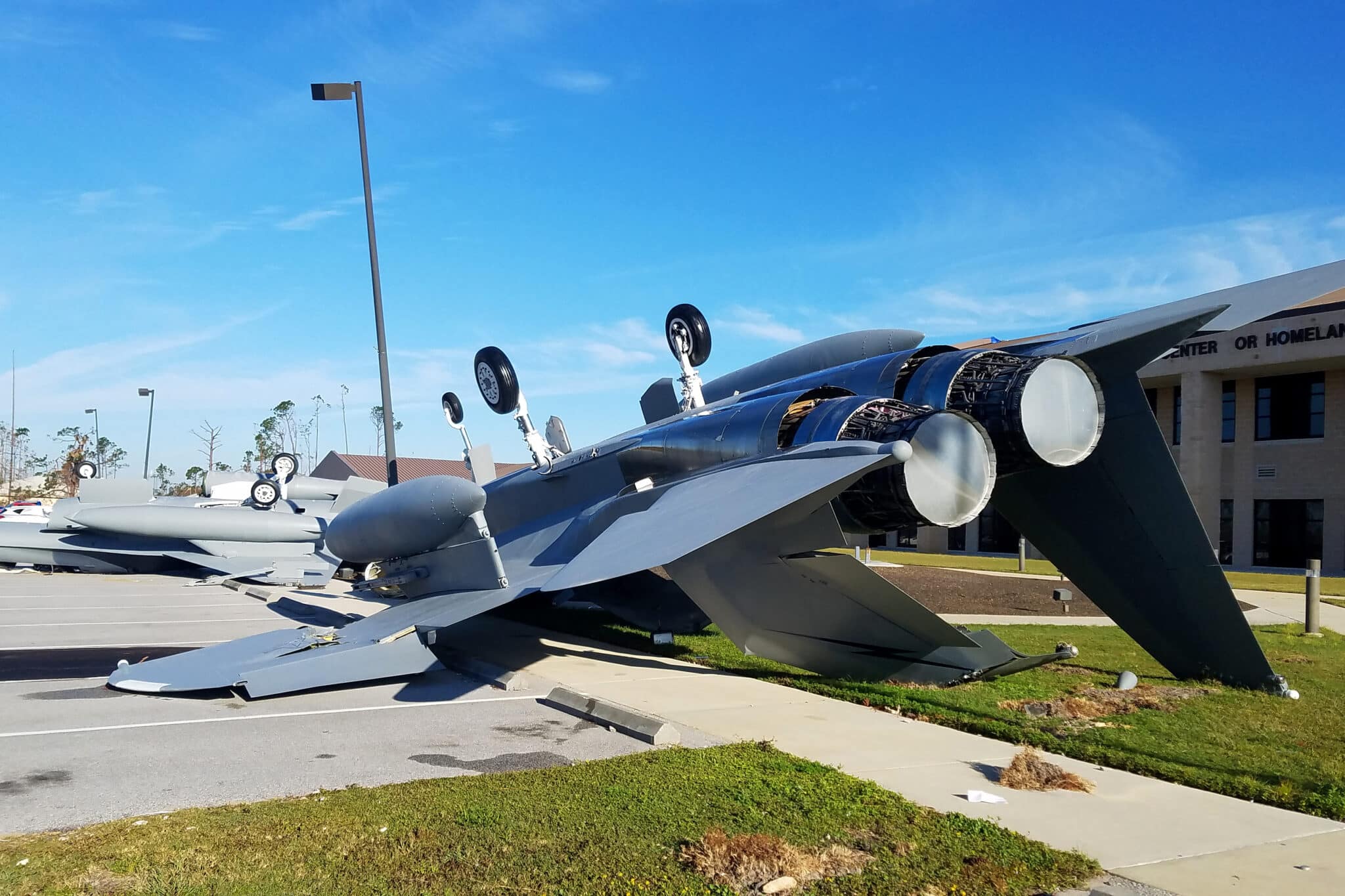 Two fighter jets flipped over in a parking lot after a storm