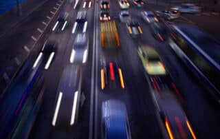 Blurred vehicles driving on a highway at night