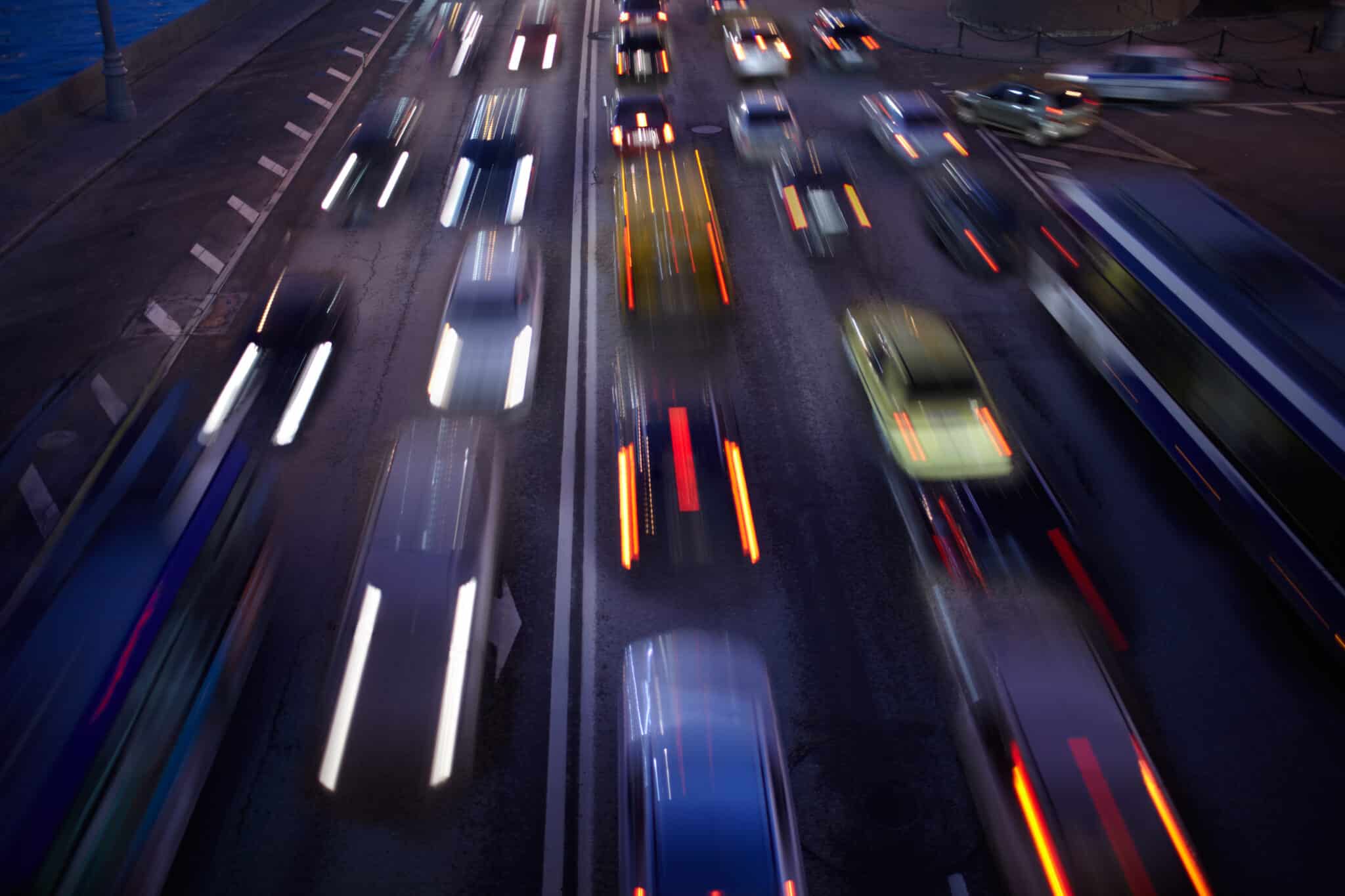 Blurred vehicles driving on a highway at night