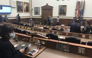 Jackie Speier wearing a mask while listening intently in a House Chamber.