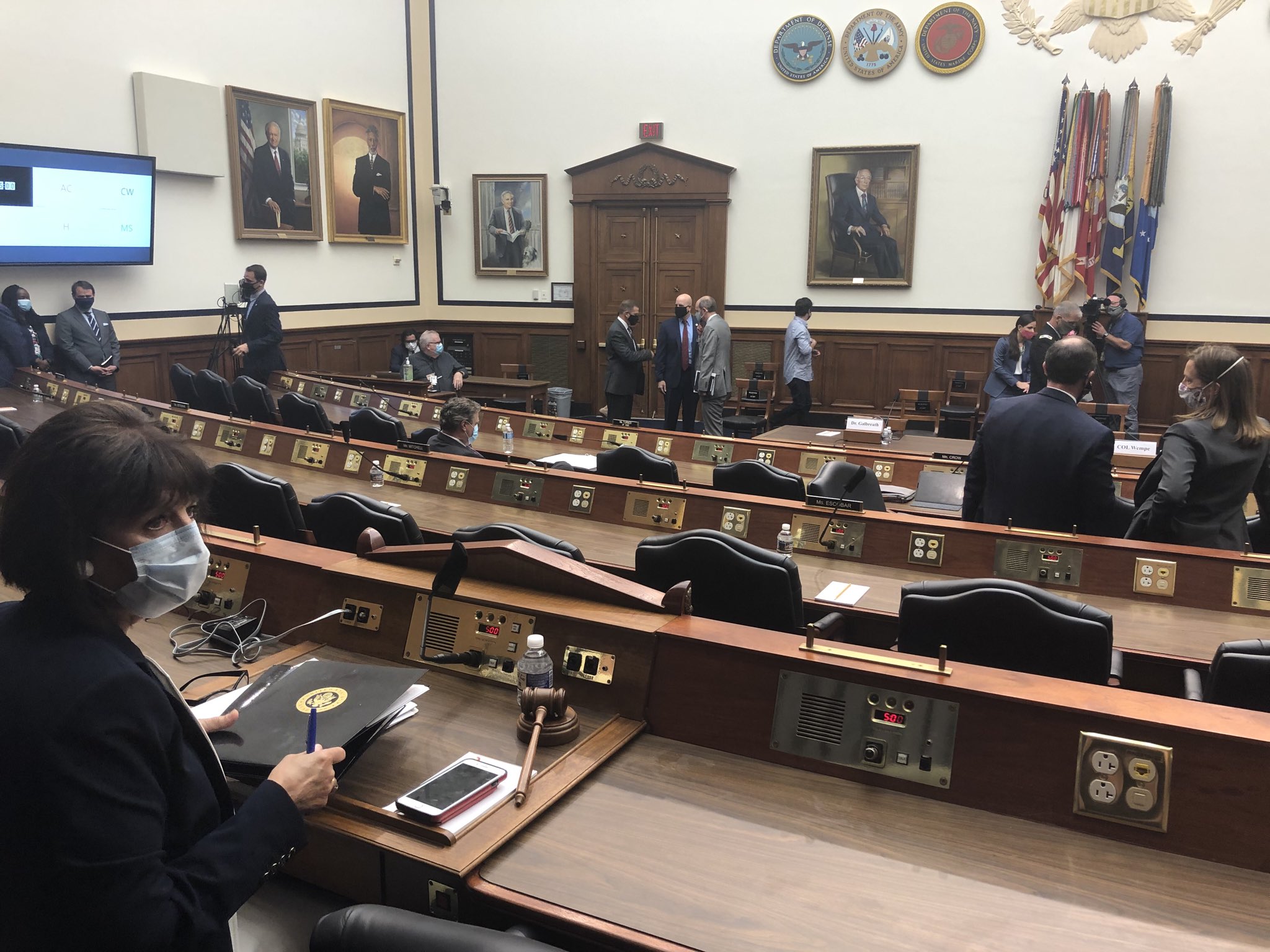 Jackie Speier wearing a mask while listening intently in a House Chamber.