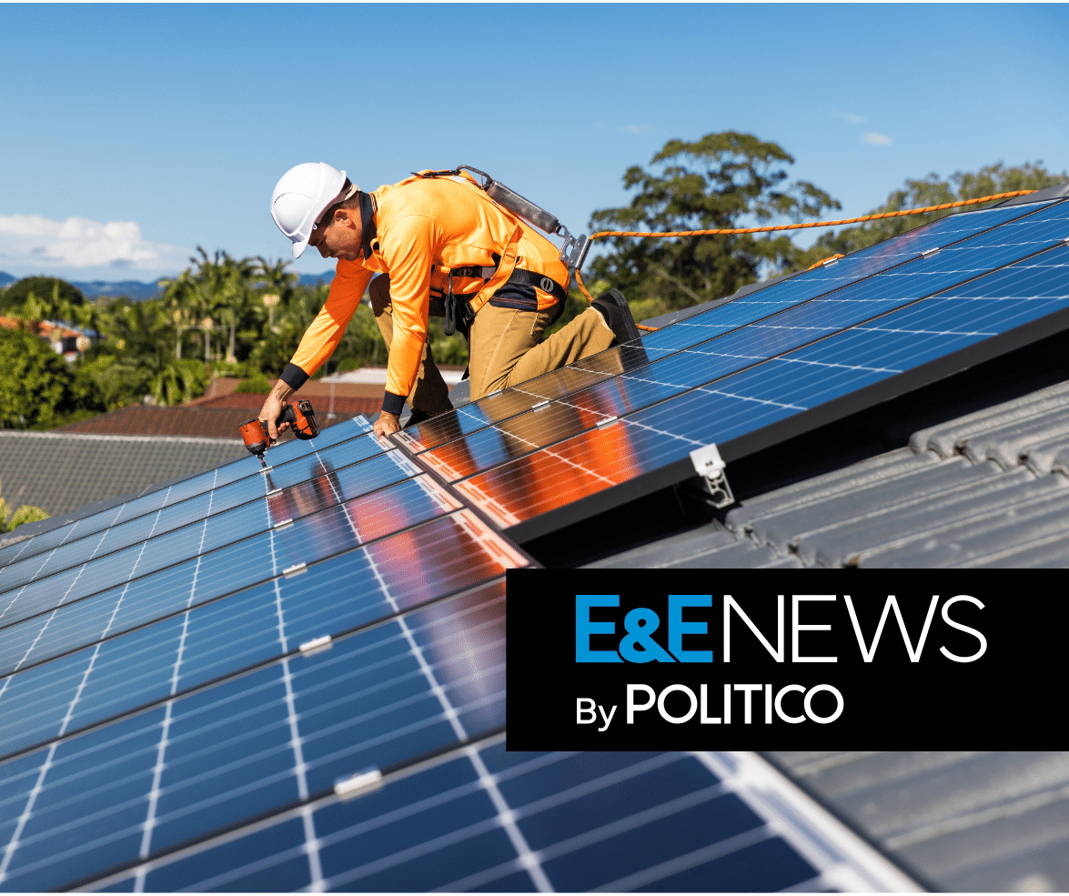 Man installing a solar panel on a hot sunny day