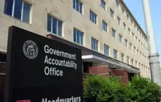 Image of USGAO and USACE sign in front of the GAO building
