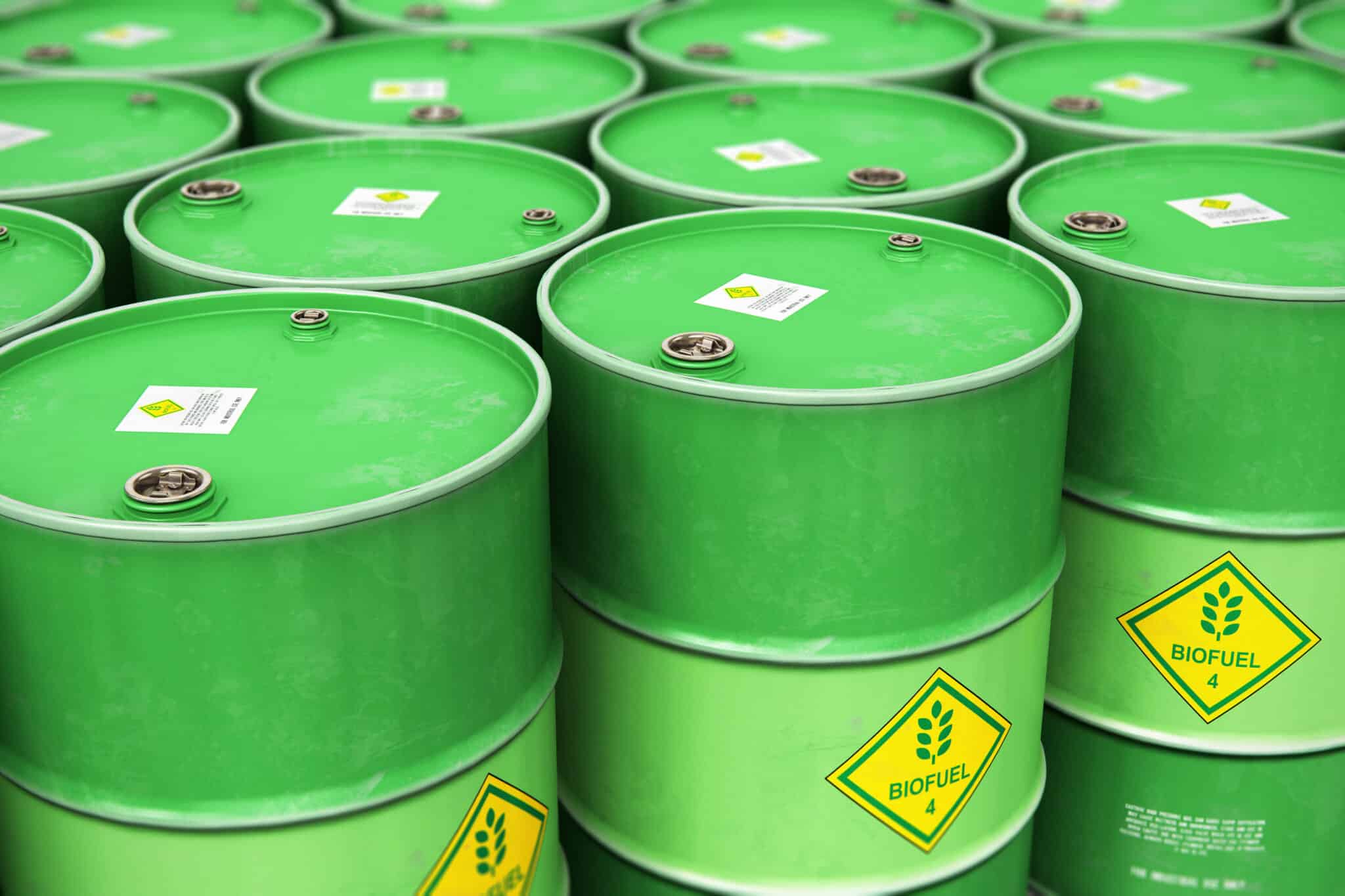 Green Biofuel drums with a yellow warning diamond that reads "BIOFUELS" in green.