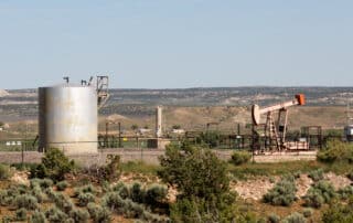 Oil pumping site in rural New Mexico by karagrubis Adobe Stock