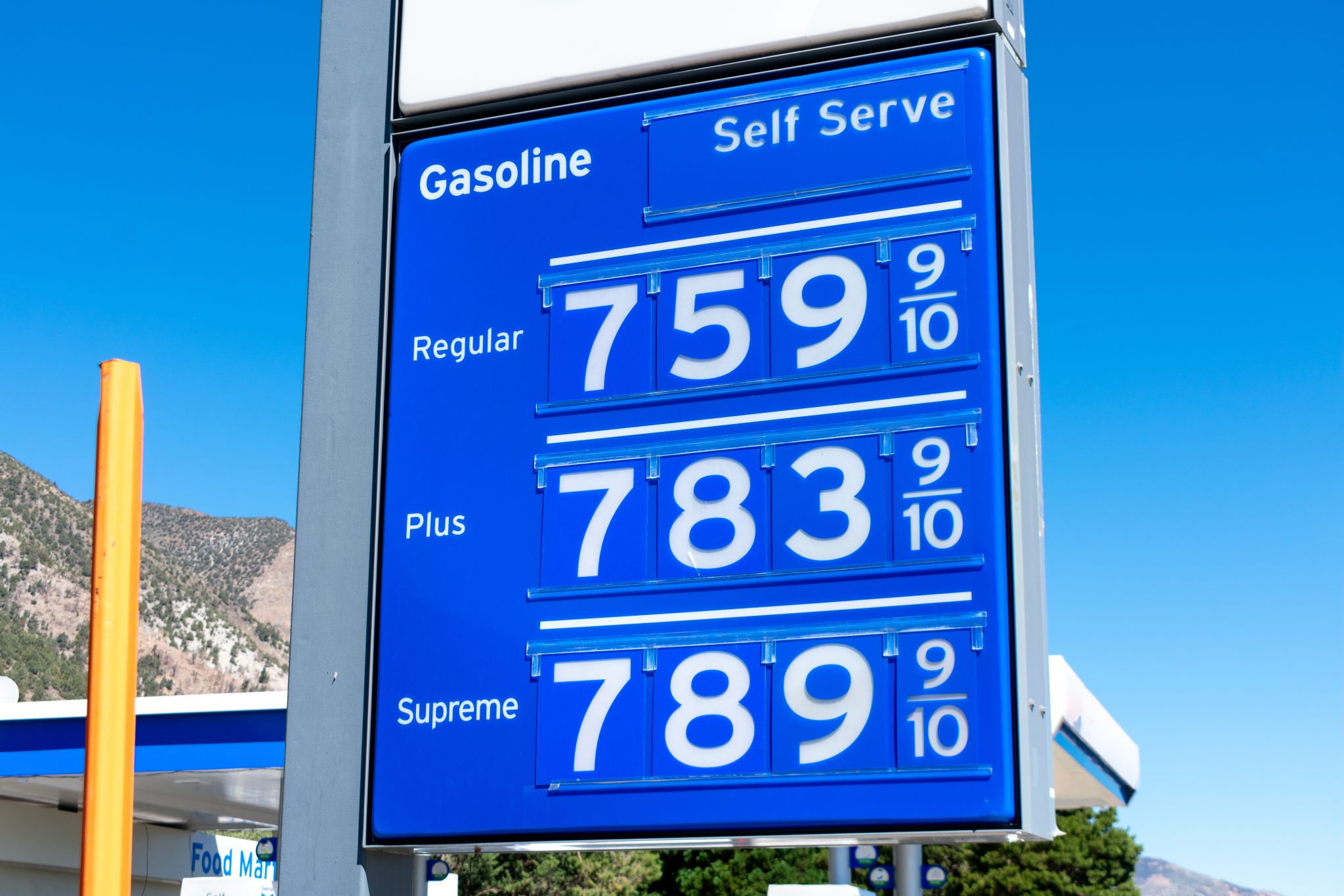 a gas station signboard with dreadfully high prices