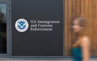 U.S Immigration and Customs Enforcement logo on a wall panel