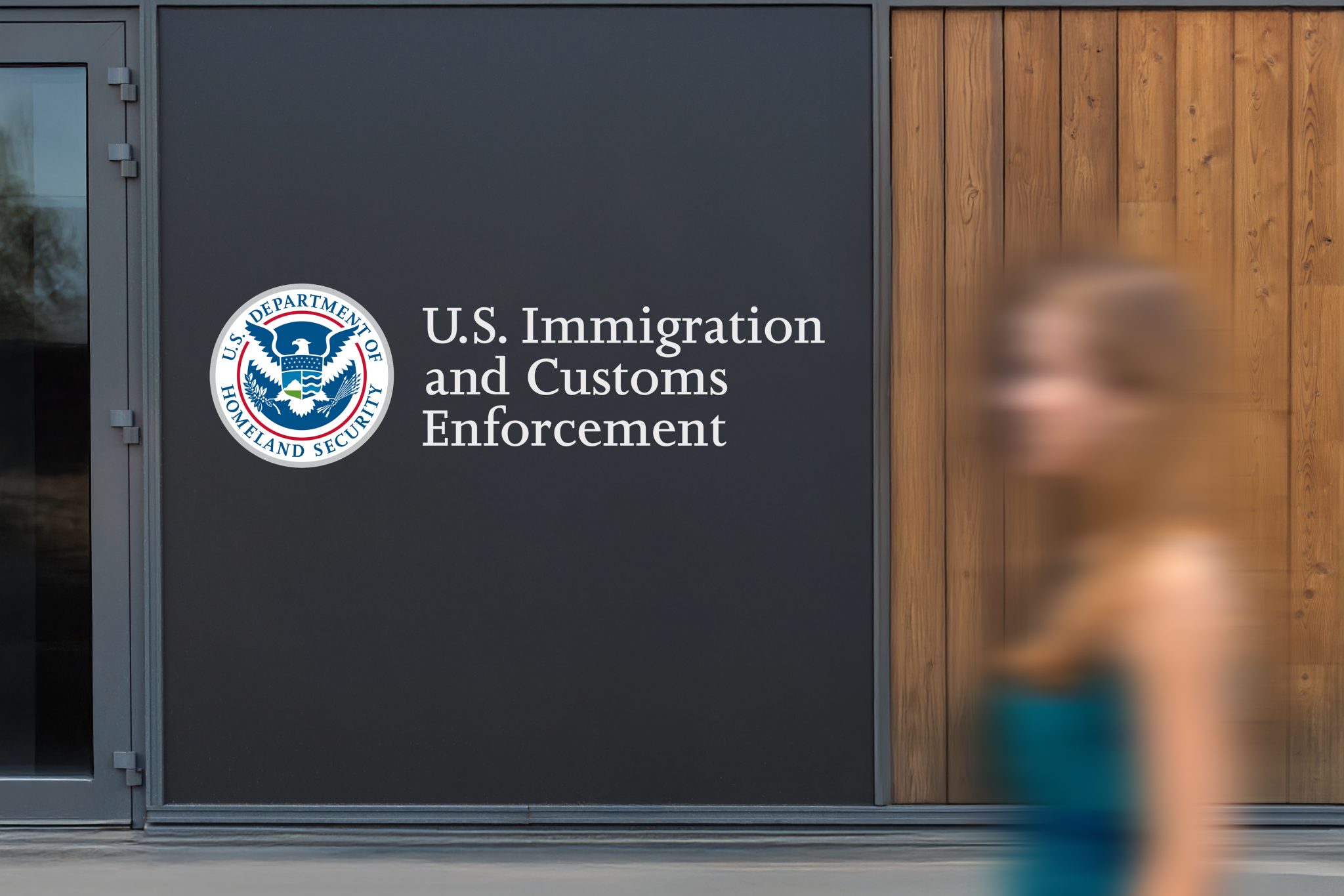 U.S Immigration and Customs Enforcement logo on a wall panel